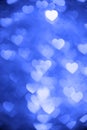 Blue color heart bokeh background photo. Abstract holiday, celebration backdrop. Royalty Free Stock Photo