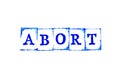 Blue ink of rubber stamp in word abort on white paper background
