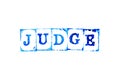 Blue ink of rubber stamp in word judge on white paper background Royalty Free Stock Photo