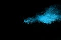 Blue color powder explosion on black background. Royalty Free Stock Photo