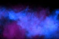 Blue color powder explosion cloud on black background.Closeup of Blue dust particles exhale on dark background Royalty Free Stock Photo