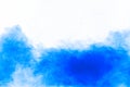 Blue color powder explosion cloud on white background.Closeup of Blue dust particles splash on background Royalty Free Stock Photo