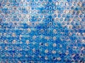 Water droplets.Blue silicone sheet.Surface roughness. Royalty Free Stock Photo