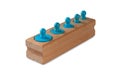 Blue color socket cylinder wooden blocks isolated on a white background. Montessori children educational toys