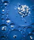 Blue colored bubbles in oil Royalty Free Stock Photo