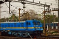 A blue colored electric rail engine of Indian Railway