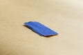 Blue colored torn paper piece. Paper stripe for scrapbooking with rough edges. Torn blue paper, Close up view. Royalty Free Stock Photo