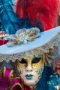 Typical carnival mask in Venice with blue hat on Royalty Free Stock Photo