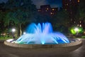 Blue colored water fountain at night Royalty Free Stock Photo