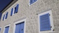 Blue colored window frame at Mediterranean house at Rose Village, Lustica peninsula, Kotor Bay, Montenegro