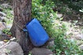 Blue colourd regional dustbin in the tropical forest. Royalty Free Stock Photo