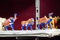 Blue coloured Elephant, camel, horse figurines displayed for sale in a shop. Various Traditional local handicraft. Selective focus