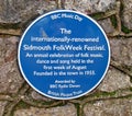 A blue commemorative plaque about the annual folk week held in Sidmouth during the first week in August each year Royalty Free Stock Photo