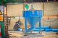 Blue concrete bucket, mixed cement container at the construction