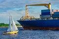 Blue container ship underway