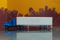 Blue Container Truck toy with Mock up container trailor side view on blur city background