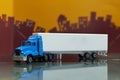 Blue Container Truck toy with Mock up container trailor side view ,selective focus ,on blur city background