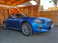 Blue convertible car Fiat 124 Spider