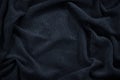 Blue corduroy. Soft folds of fabric. Elegant background with copy space Royalty Free Stock Photo