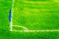 Blue Corner Flag on a Football Field with Bright Fresh Green Turf Grass and White Soccer Touch Lines Royalty Free Stock Photo