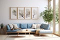 Blue corner sofa in the living room, coffee table and a set of posters on the wall. Large windows and daylight. Modern trendy Royalty Free Stock Photo