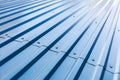 Blue corrugated metal roof with rivets