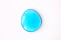 Blue cosmetics gel smear or slime drop on white background