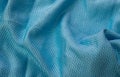 Blue cotton fabric with an interesting pattern Royalty Free Stock Photo