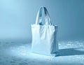 Blue Cotton Tote Bag on a Matching Background with Small White Objects Royalty Free Stock Photo