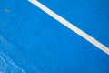 Blue court with white line. Empty sport field photo. Hard cover surface for lawn tennis. Summer sport activity