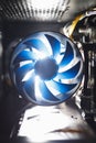 Blue cpu cooler inside PC case, shiny light background Royalty Free Stock Photo