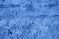 The surface of the cracked dried clay background. Color of the year 2020 classic blue. Royalty Free Stock Photo