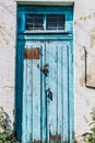 Blue cracked, vintage closed, old door with lock