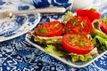Blue crockery with fresh tomatoes