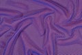 Blue crumpled nonwoven fabric on a orange Royalty Free Stock Photo