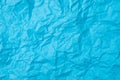 Blue crumpled paper texture as background