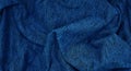 blue crumpled scarf cotton fabric texture, close up view, use as background. folded canvas fabric. Royalty Free Stock Photo