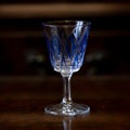 Blue crystal antique engraved shot glass close-up. Royalty Free Stock Photo