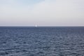 Blue crystal clear water. Ship in the middle of the sea