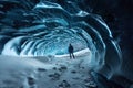 Blue crystal ice cave entrance with tourist climber and an underground river beneath the glacier located in the Royalty Free Stock Photo