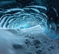 Blue crystal ice cave entrance and an underground river beneath the glacier located in the Highlands in Iceland Royalty Free Stock Photo