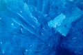 Blue crystalline mineral stone. Macro. Abstract technological background from crystals of the mineral in blue. Close-up