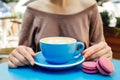 Blue cup of aromatic coffee on a blue table. Royalty Free Stock Photo