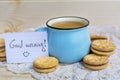 Cup of coffee  with biscuits and good morning card  on wooden background Royalty Free Stock Photo