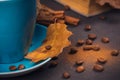 Blue cup of coffee with coffee beans and autumnal dry leaves Royalty Free Stock Photo