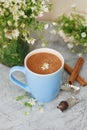 Blue Cup of Coffee Milk Latte Drink Cinnamon Sticks Wooden Background Rustic Camomile Flower Buquet Flat Lay Royalty Free Stock Photo