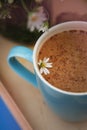 Blue Cup of Coffee Milk Latte Drink Cinnamon Sticks Wooden Background Rustic Camomile Flower Buquet Flat Lay