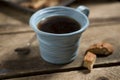 Blue Cup Containing Coffee or Tea with Spoon and Biscuits