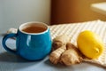 Blue cup of herbal tea with ginger and lemon Royalty Free Stock Photo