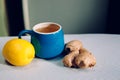 Blue cup of herbal tea with ginger and lemon Royalty Free Stock Photo
